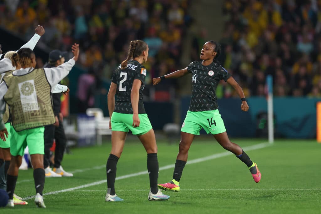 Super Falcons players celebrate after scoring