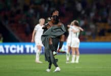 Super Falcons squad players in warm embrace