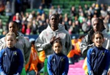 Nigeria Super Falcons players sing the national anthem